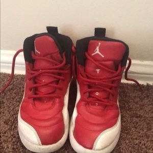 Red and white Jordan 12s